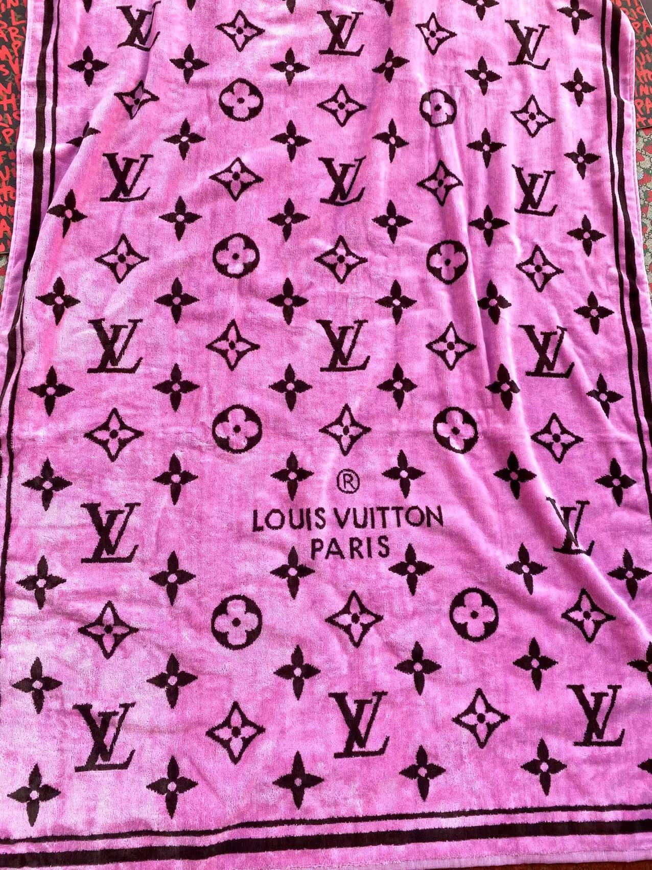 Pink fabric with black Louis Vuitton logo pattern