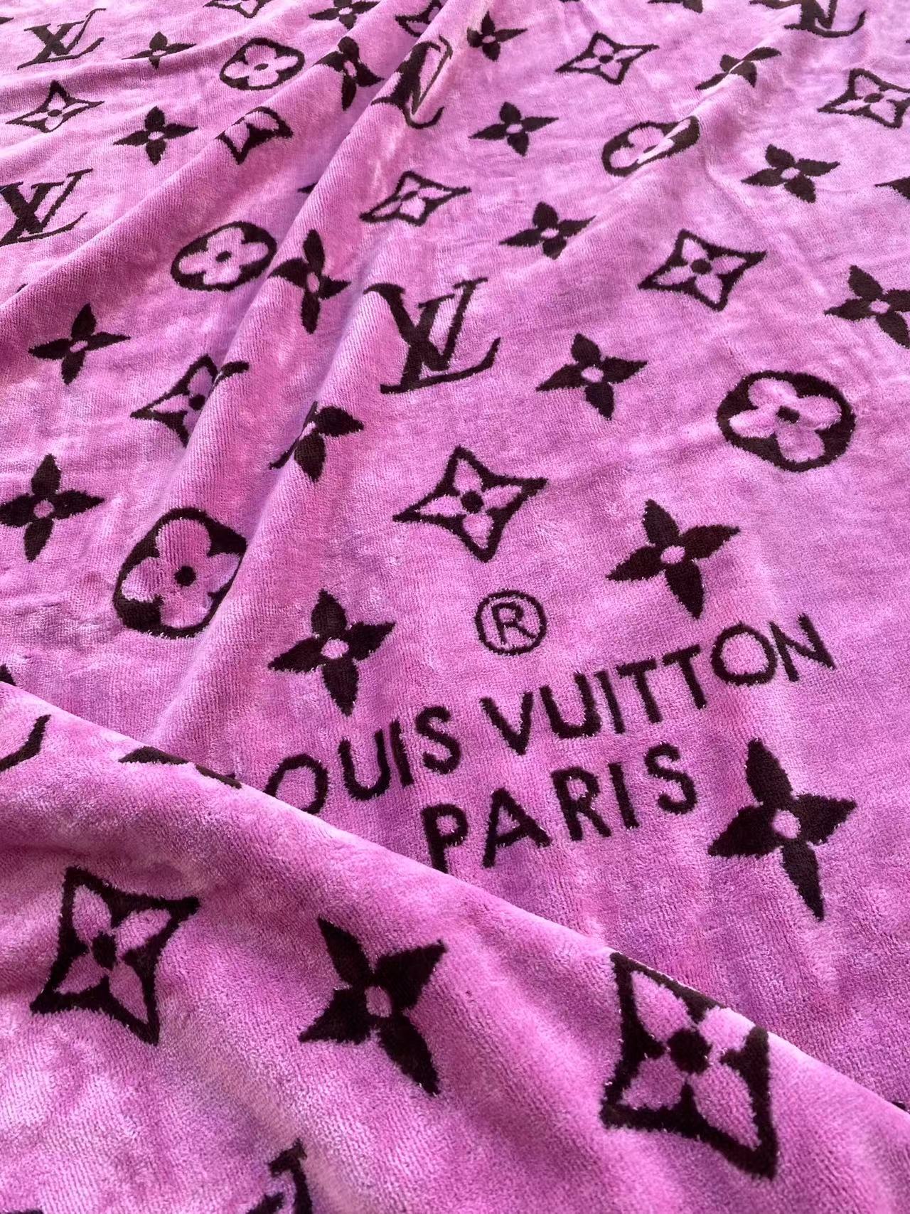 Pink beach towel with black Louis Vuitton logo pattern